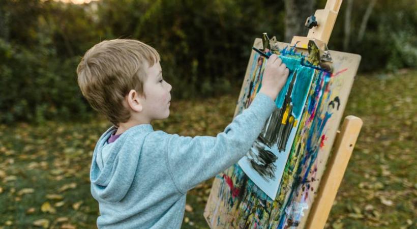 image of a young person painting 