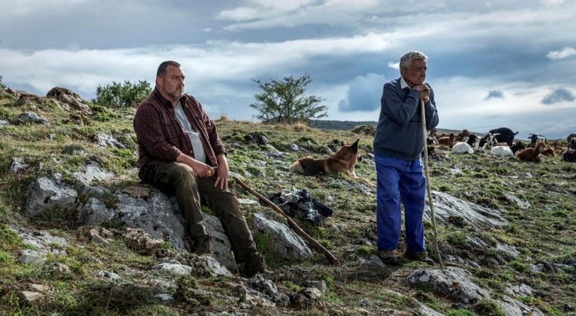 Two men in a mountainside landscape